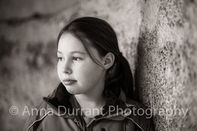 girl looking pensively out of the picture