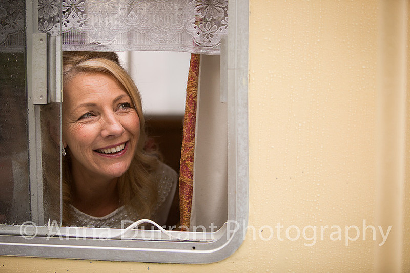 Bride looking out of barge window
