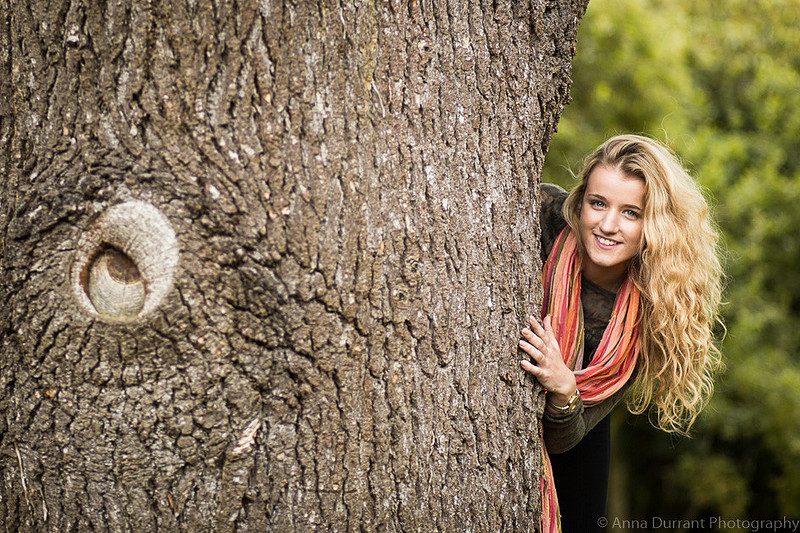 Peeping out from behind a tree